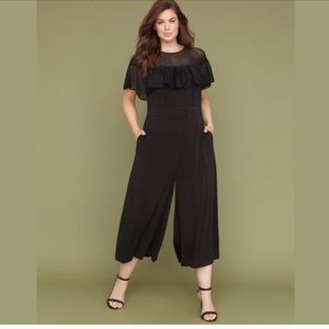 Black jumpsuit with eyelet lace illusion top